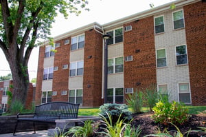 Madison Villa - Exterior with bench view of senior apartments in Cincinnati
